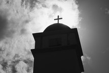 silhouette of a church steeple and cross topper 