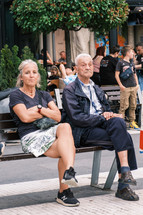 People sitting on a bench in Europe