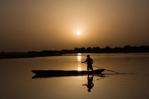 Silhouette of boat at sunset