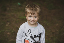 Little boy in  Micky Mouse shirt 