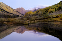 Sunrise in Crested Butte Colorado in the Fall Season as the mountains reflect in the beaver pond