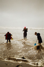 family on a beach in winter 
