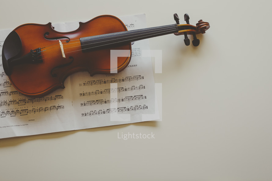 a violin on sheet music