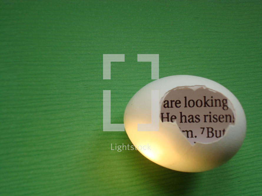 eggshell with a piece of the bible inside saying: HE HAS RISEN!, 
