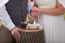 a bride and groom receiving communion 