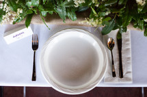 a place setting for a groom at a wedding 