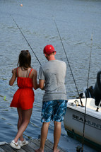 brother and sister fishing on a dock
