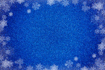 blue Glitter Background with snowflake border 