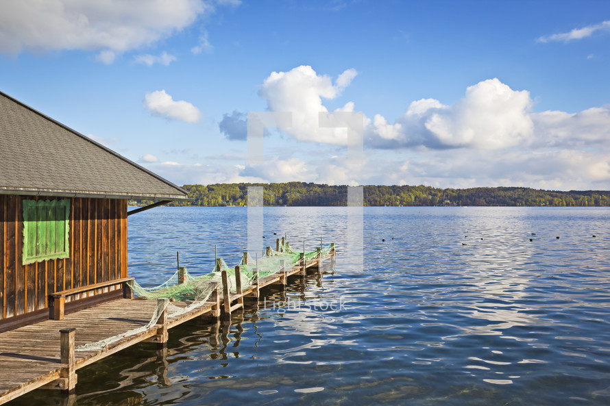 boat house and dock on a lake 