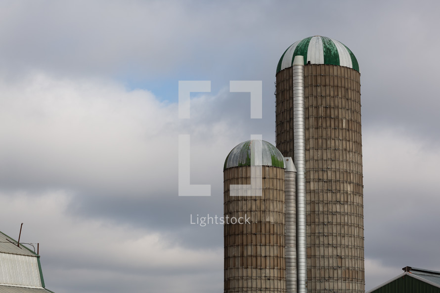 Green and white striped capped silos