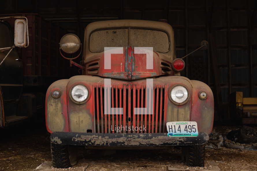 Red, vintage truck in a barn