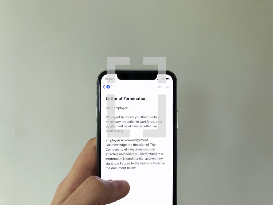 Letter of Termination on a cellphone screen 
