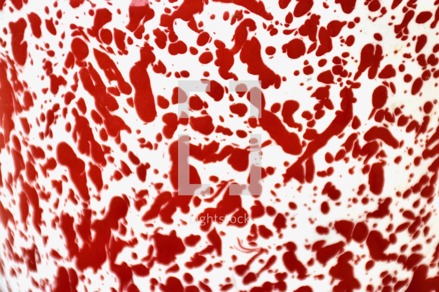red and white abstract swirled paint splatter background 