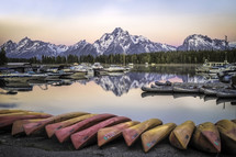 canoes on a lake shore 