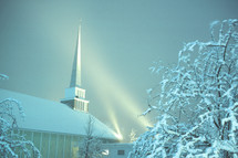 East Glenville Community Church near Schenectady, New York on a snowy evening with steeple lights on