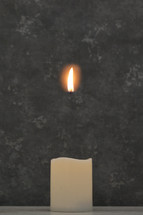 Abstract separated flame from a candle in studio