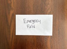 Emergency fund - money in an envelope 