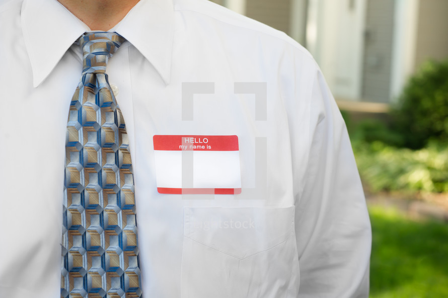 blank name tag on a man 