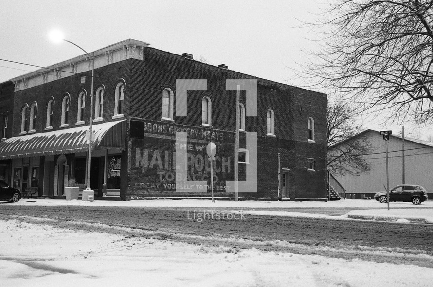 A historic main street in snow, shot on film.