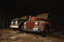 Vintage trucks in a barn