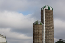 Green and white striped capped silos