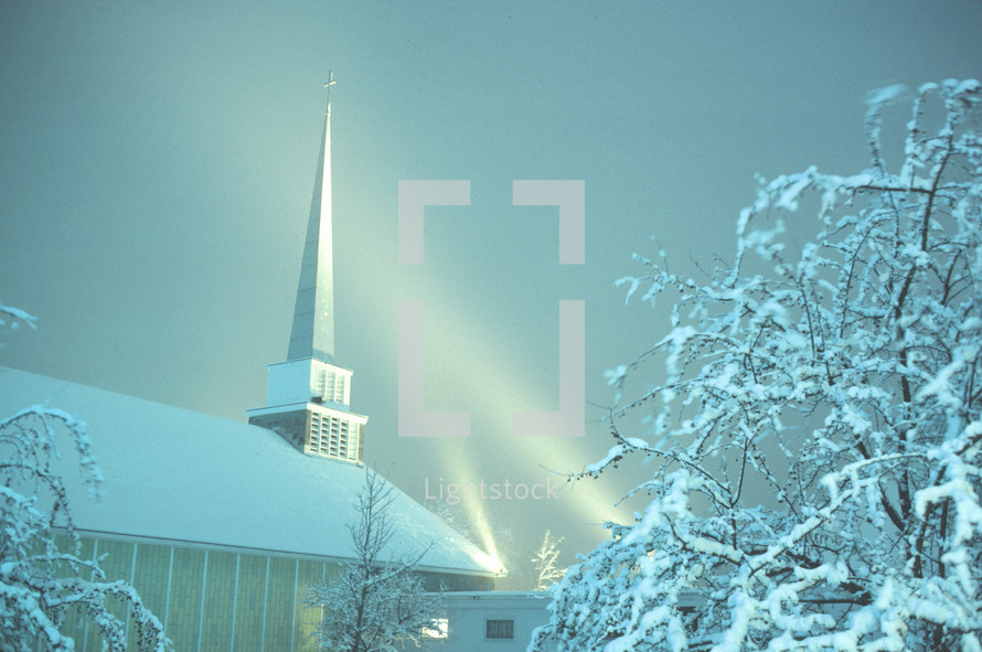 East Glenville Community Church near Schenectady, New York on a snowy evening with steeple lights on