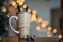 a coffee mug and coffee sticks 