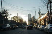 traffic on a downtown street at sunset 