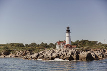 a lighthouse and sea wall 