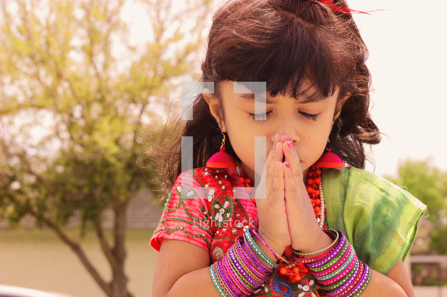 Cute girl praying