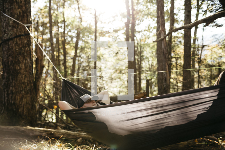 man resting in a hammock 