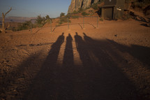shadows of people on red earth