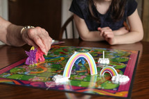 grandmother and granddaughter playing board games 