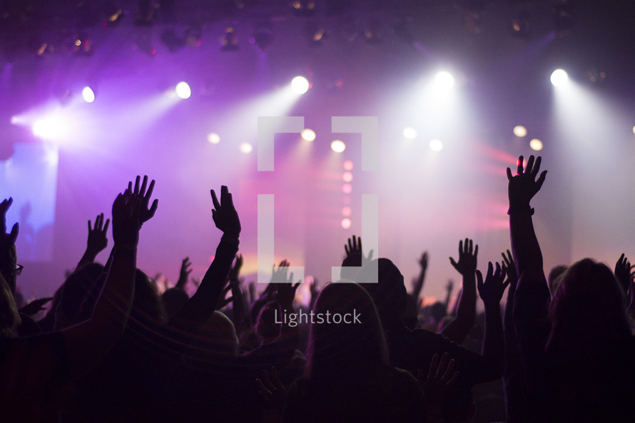 raised hands during a contemporary worship service 