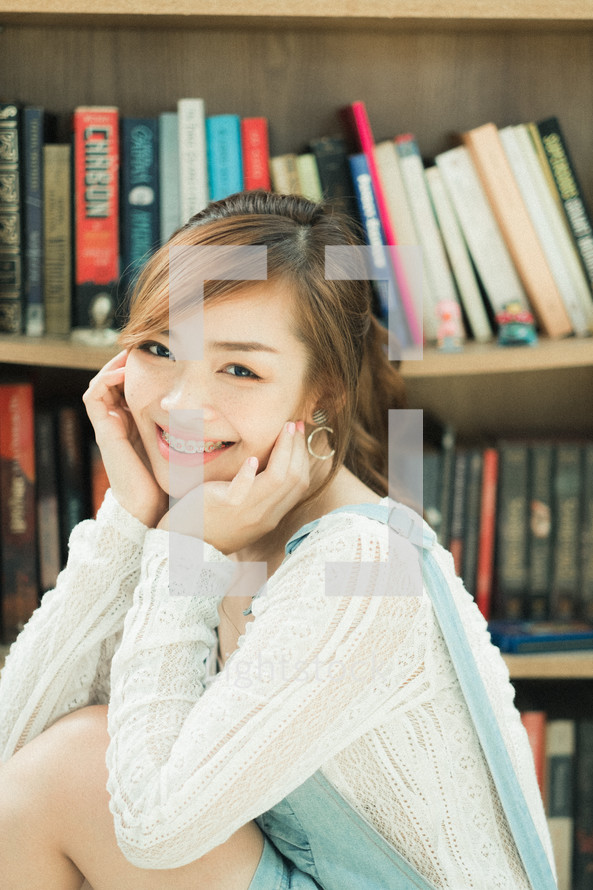 smiling teen girl in a library 