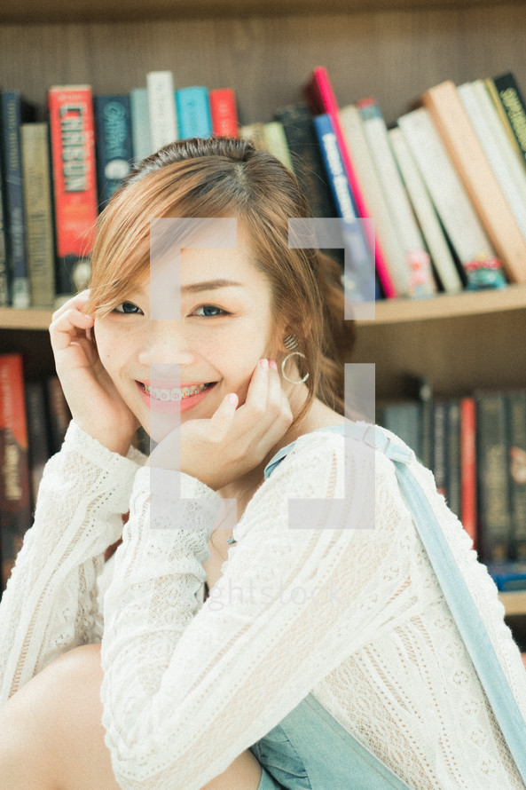 smiling teen girl in a library 