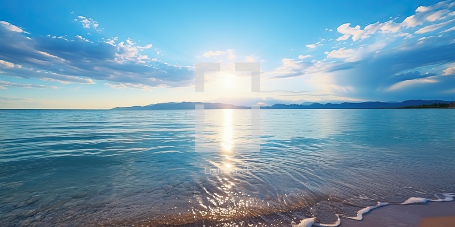  Sunset illuminating a calm sea with a sandy shore under a partly cloudy sky