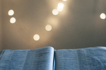 bokeh lights and an open Bible 