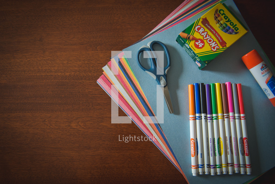 school supplies on a wood table 