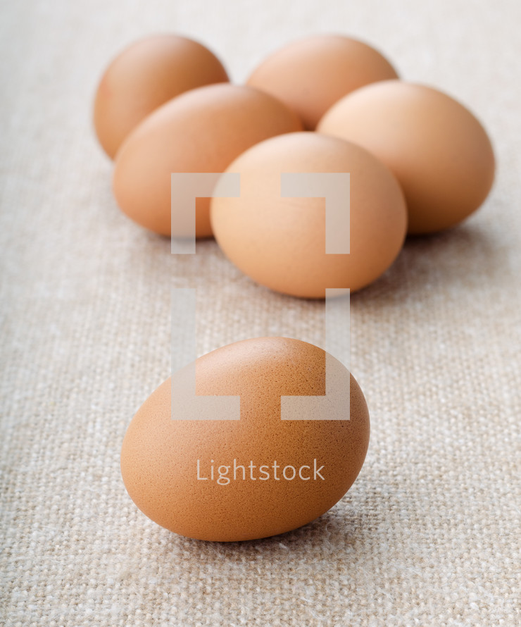 Natural chicken  eggs on burlap background