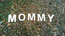 word Mommy in grass 