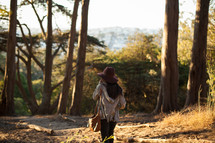 girl walking in the woods 