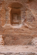 Niche and writing on a wall in Petra