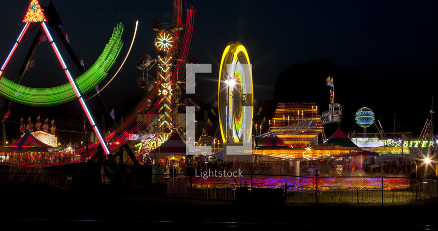 blur of lights from an amusement park at night 