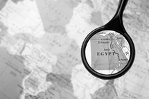 magnifying glass over a map of Egypt
