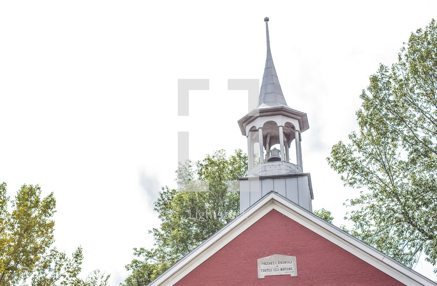 steeple on a red church 