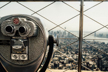 a viewfinder scope at the top of a skyscraper in NYC 