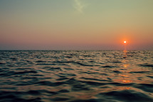 The sun on the horizon of the ocean.