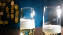 Glasses filling with champagne for Christmas Holidays