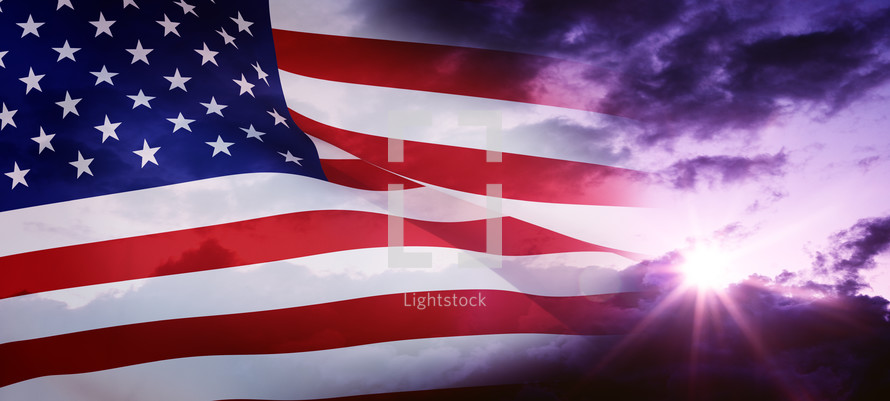 American flag against a purple sky 